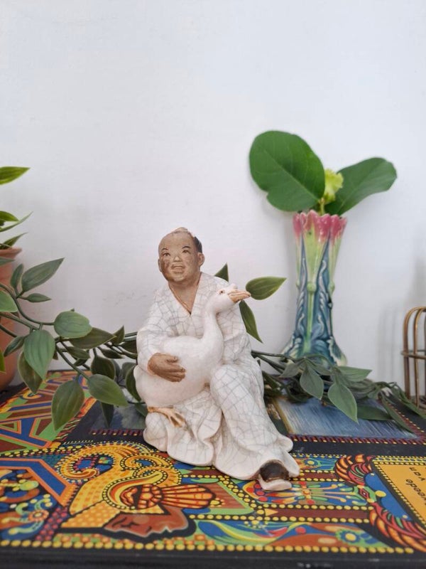 Oosters beeld jongen met gans