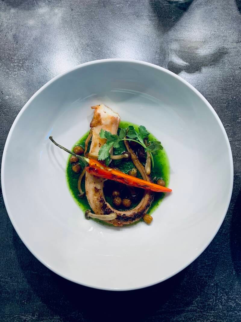 Octopus legs with chick peas, chiorize, shimeji, coriander .