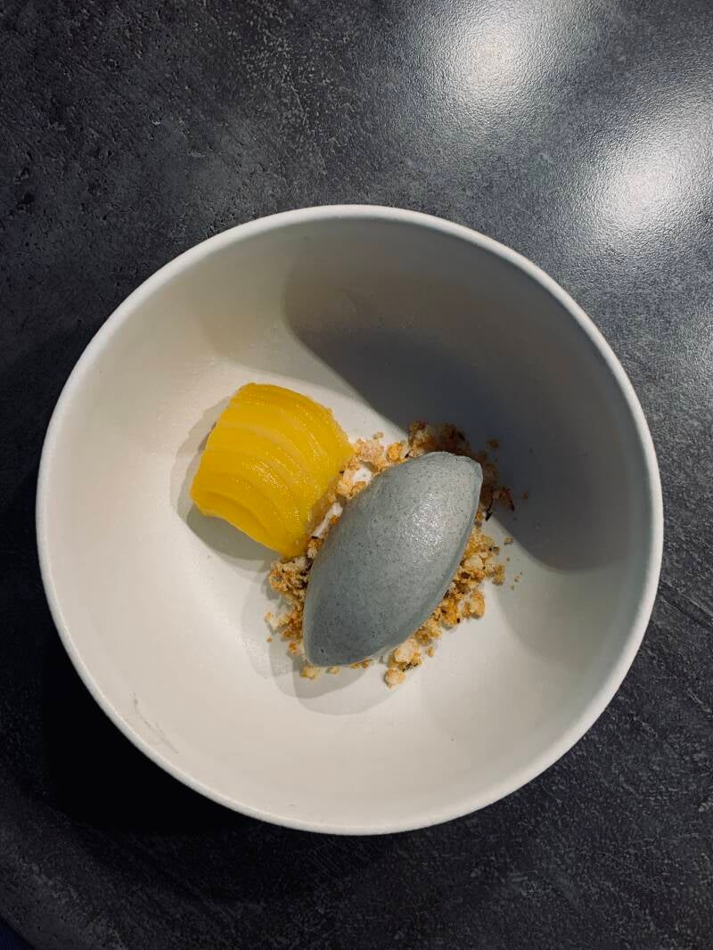Black seasame ice cream, poached pear with turmeric, seaweed rice crackers,