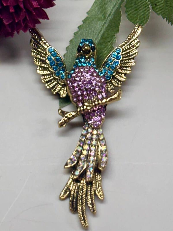 Vintage look broche gekleurde vogel