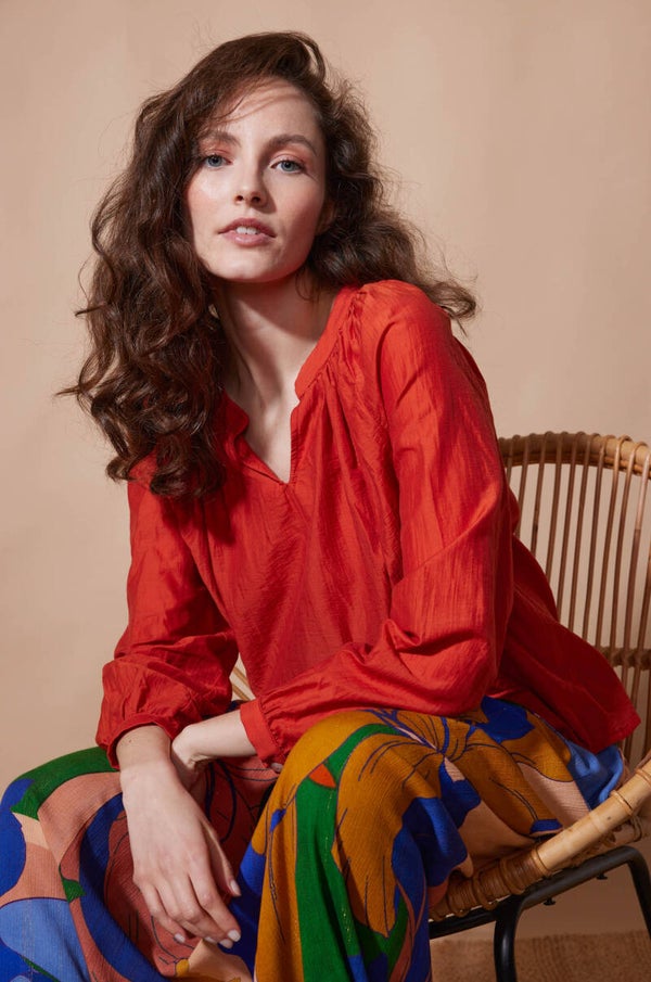 oranje blouse met raglanmouwen