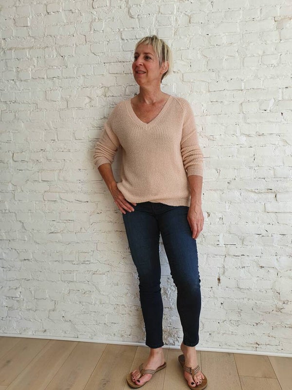 zachtroze trui met glitter