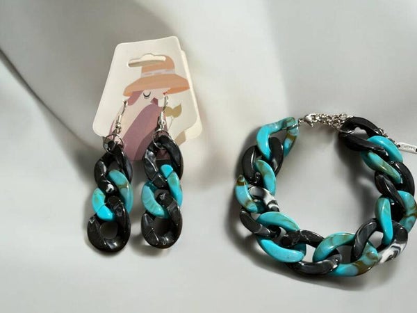 Elegante schakelarmband en bijpassende oorbellen in de kleuren turqoise en zwart