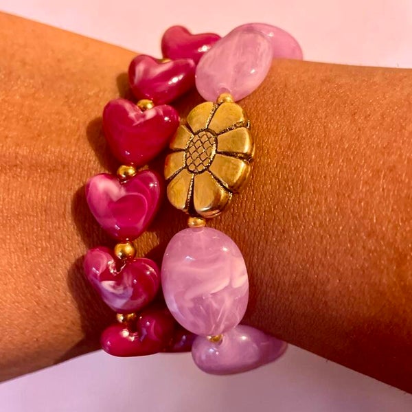 Set armbanden in roze en paarse tinten
