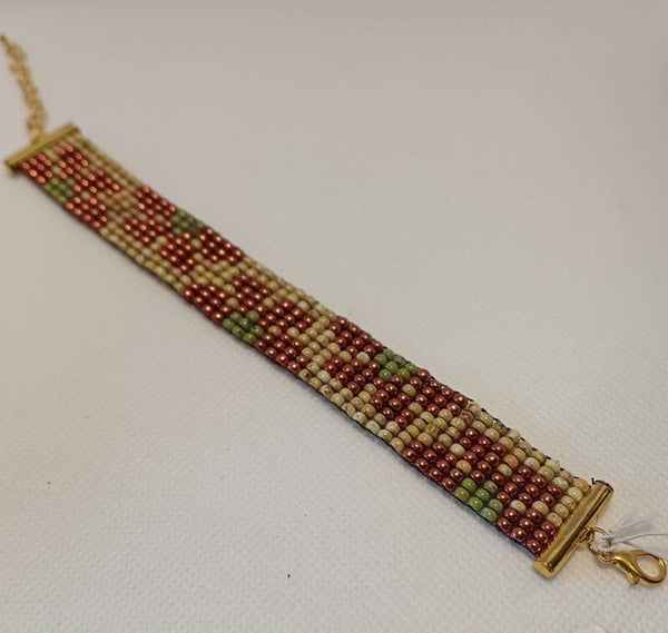 Armband geweven bloem oranje