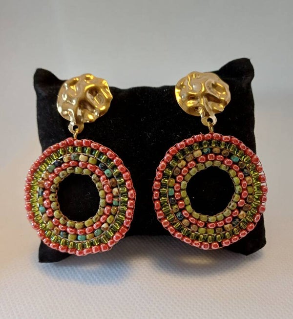 Oorbellen rond oranje / groen