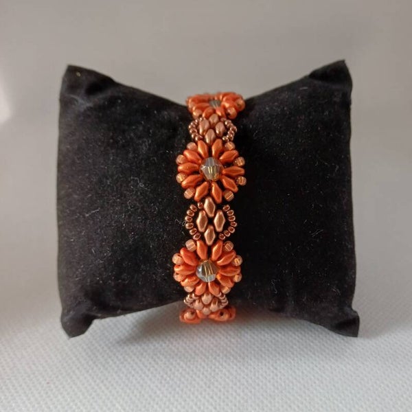 Armband kraaltjes zacht oranje