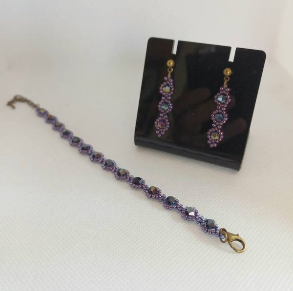 Setje armband en oorbellen paars