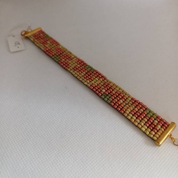 Armband geweven bloem oranje