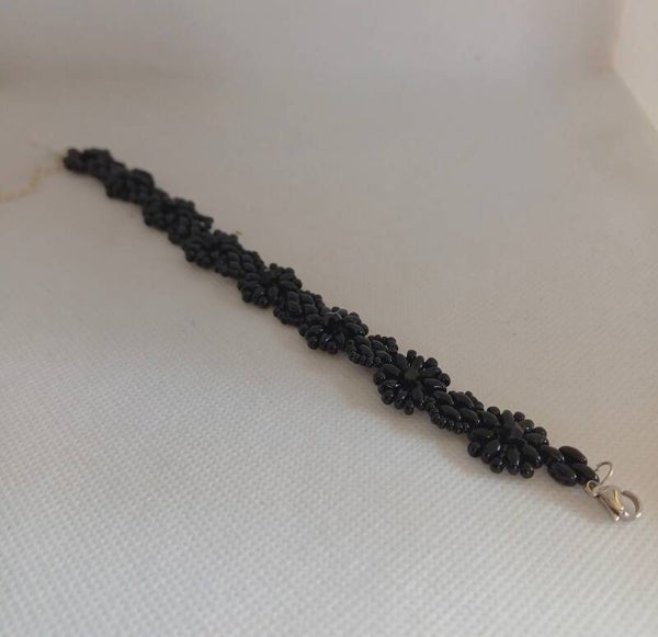 Armband zwart geregen