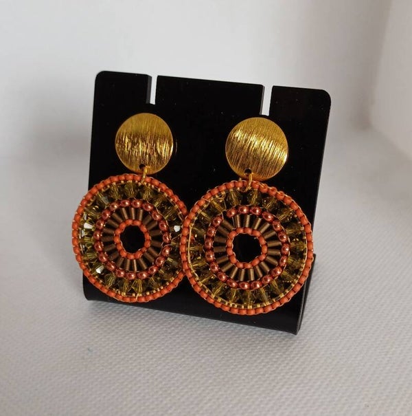 Oorbellen rond oranje / groen