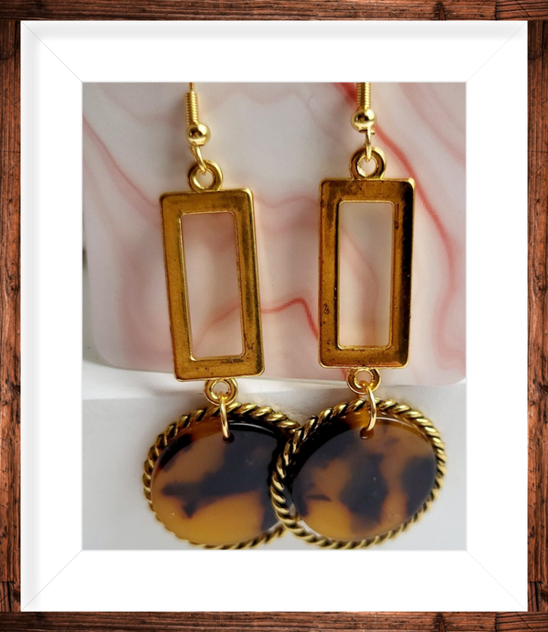 Boucles d’oreilles dorées pendantes