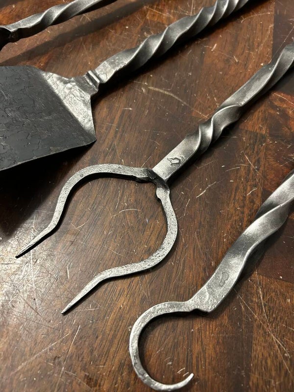 Hand forged one piece bbq tool set.
