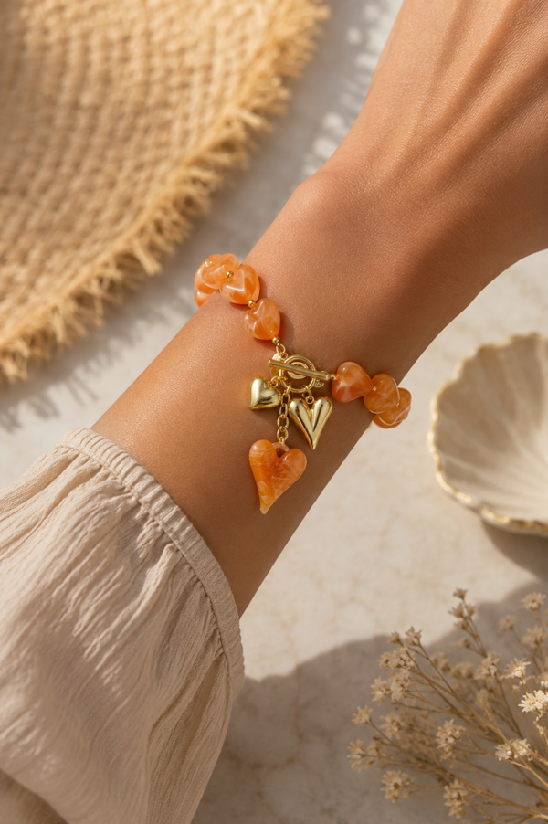 Oranje Hartjes Armband met Gouden Bedels – Stainless Steel | Trendy Damesarmband