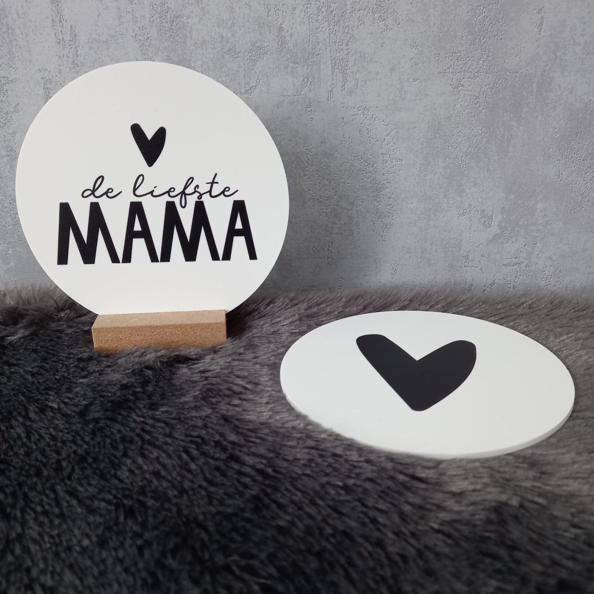 Een cirkel met een boodschap "De liefste mama"