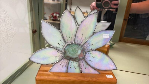 white flower on stand