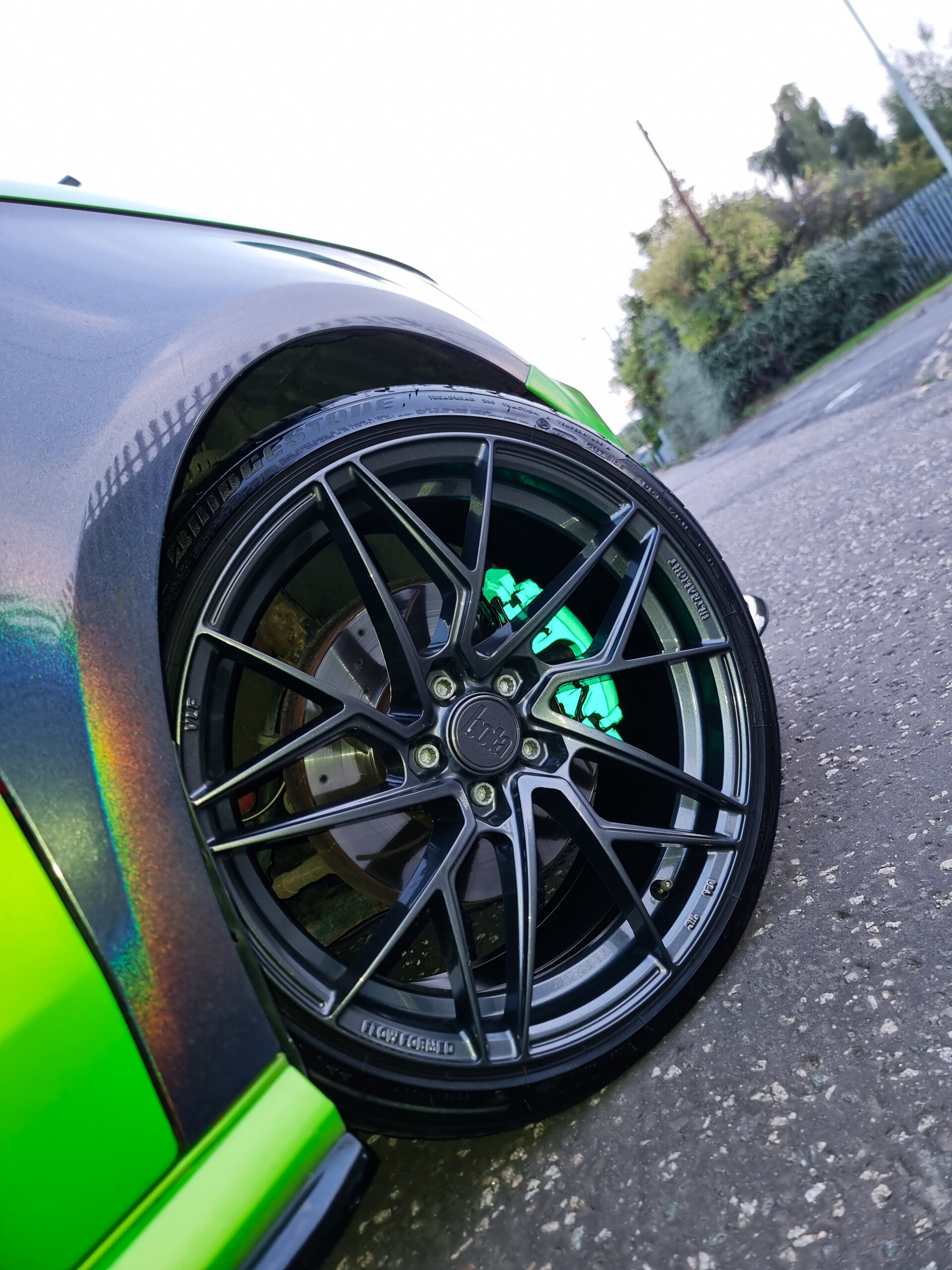 Reflective green brake calipers