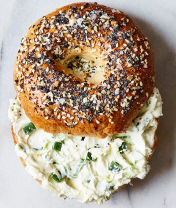 EVERYTHING BAGEL - Bite into a golden toasted everything bagel generously coated in traditional spices accompanied by a creamy and savory chive and onion cream cheese