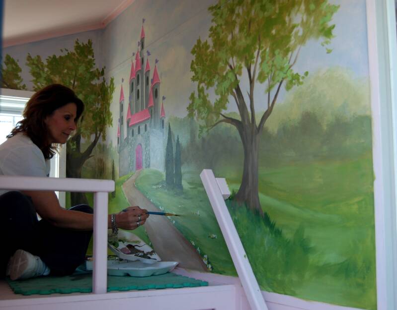 Regann Painting a Mural