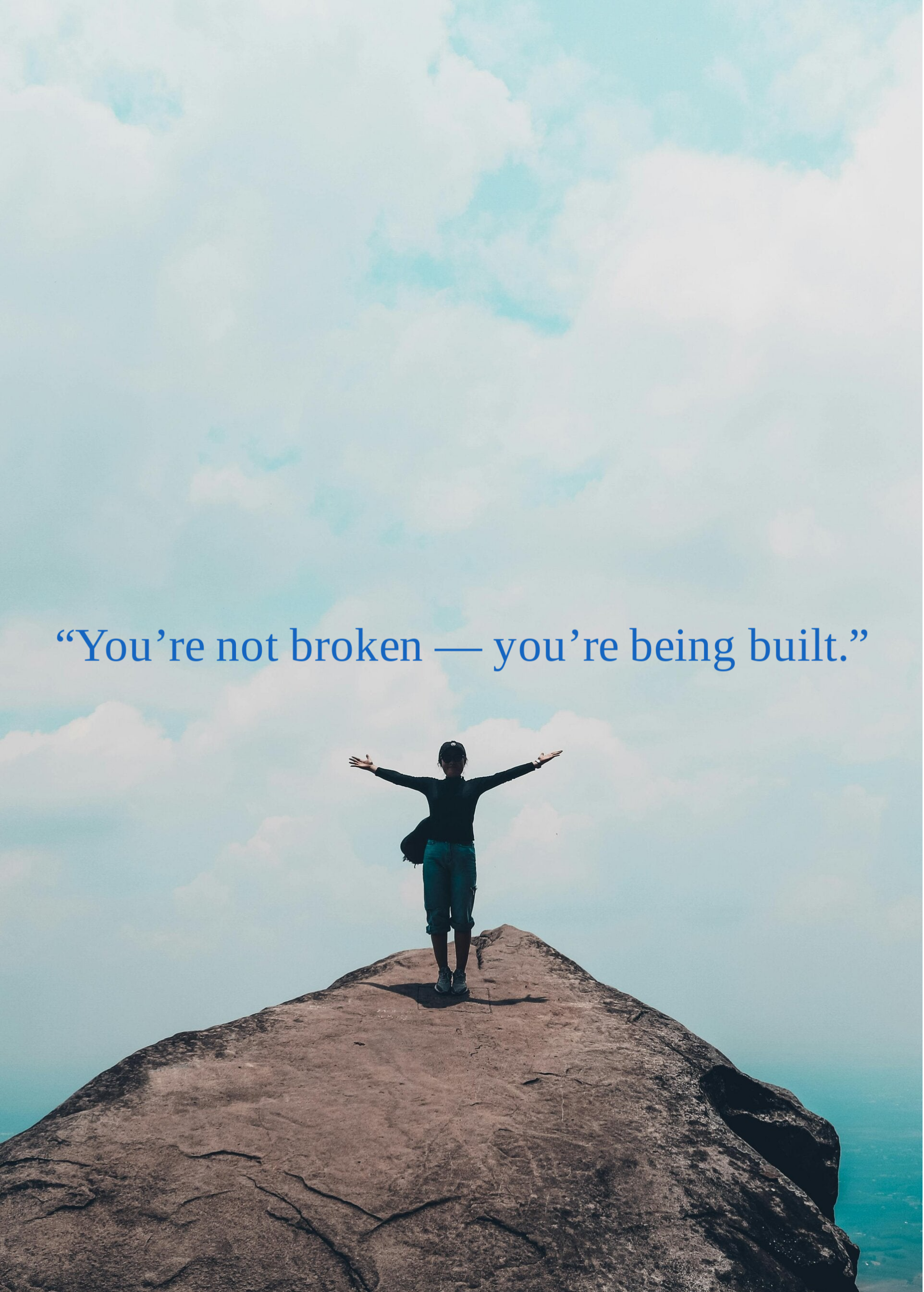 Woman standing on a hill with arms wide open, embracing sunlight and freedom, symbolizing spiritual awakening, hope, and personal transformation.