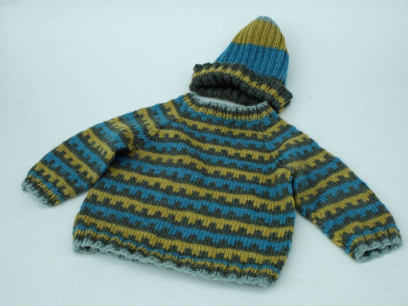 Håndstrikket babytrøje og hue i uld - str. 9 mdr.  350 kr. 