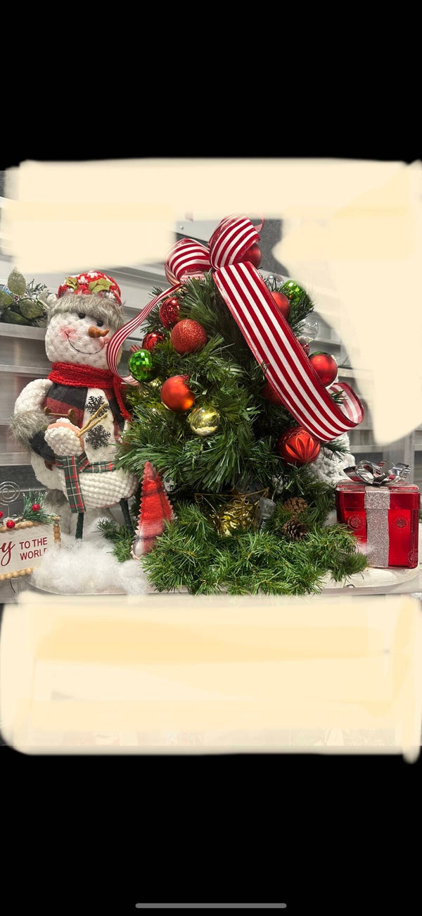 Snowy Holding Christmas tree tight