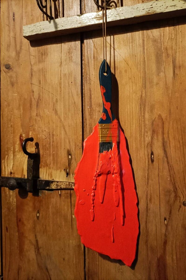 Kleurrijke muurkwast oranje