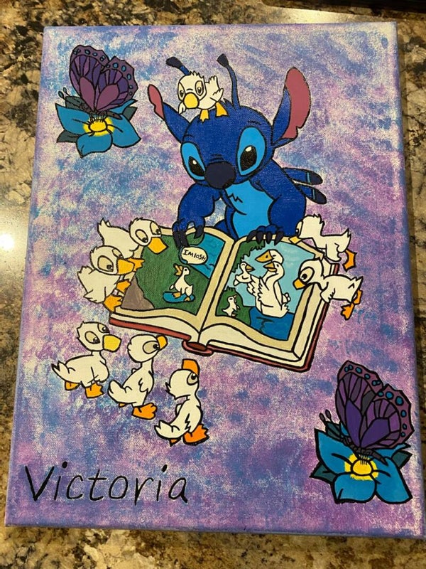 Stitch reading to the ducklings painting