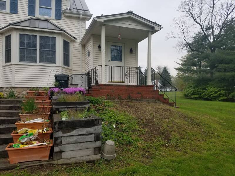 Before photo showing the original backyard area prior to deck construction.