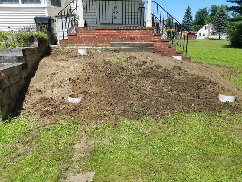 Composite deck under construction with tools, materials, and unfinished surfaces visible.