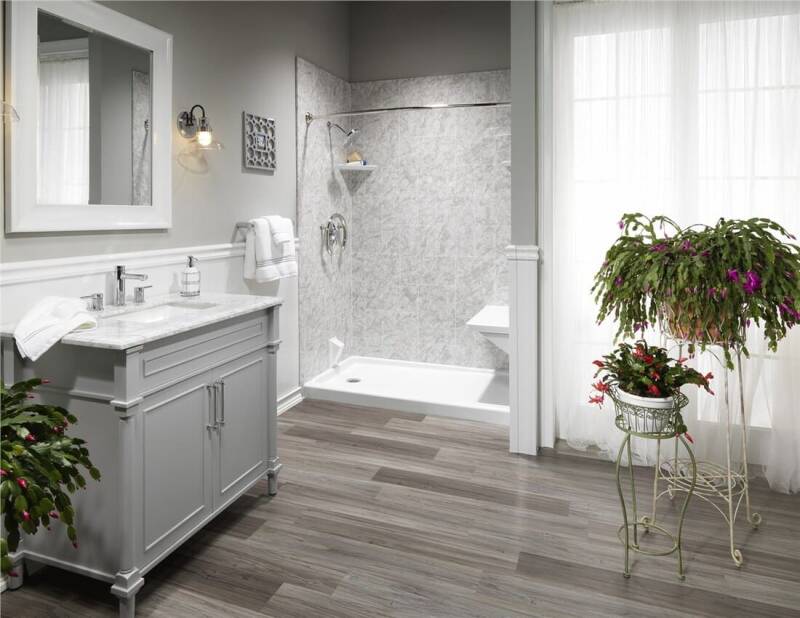 Updated bathroom with modern shower tile, clean lines, and contemporary fixtures.