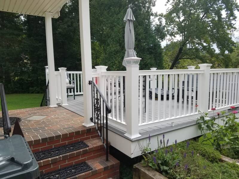 Finished composite deck with seating area and clean exterior finishes.