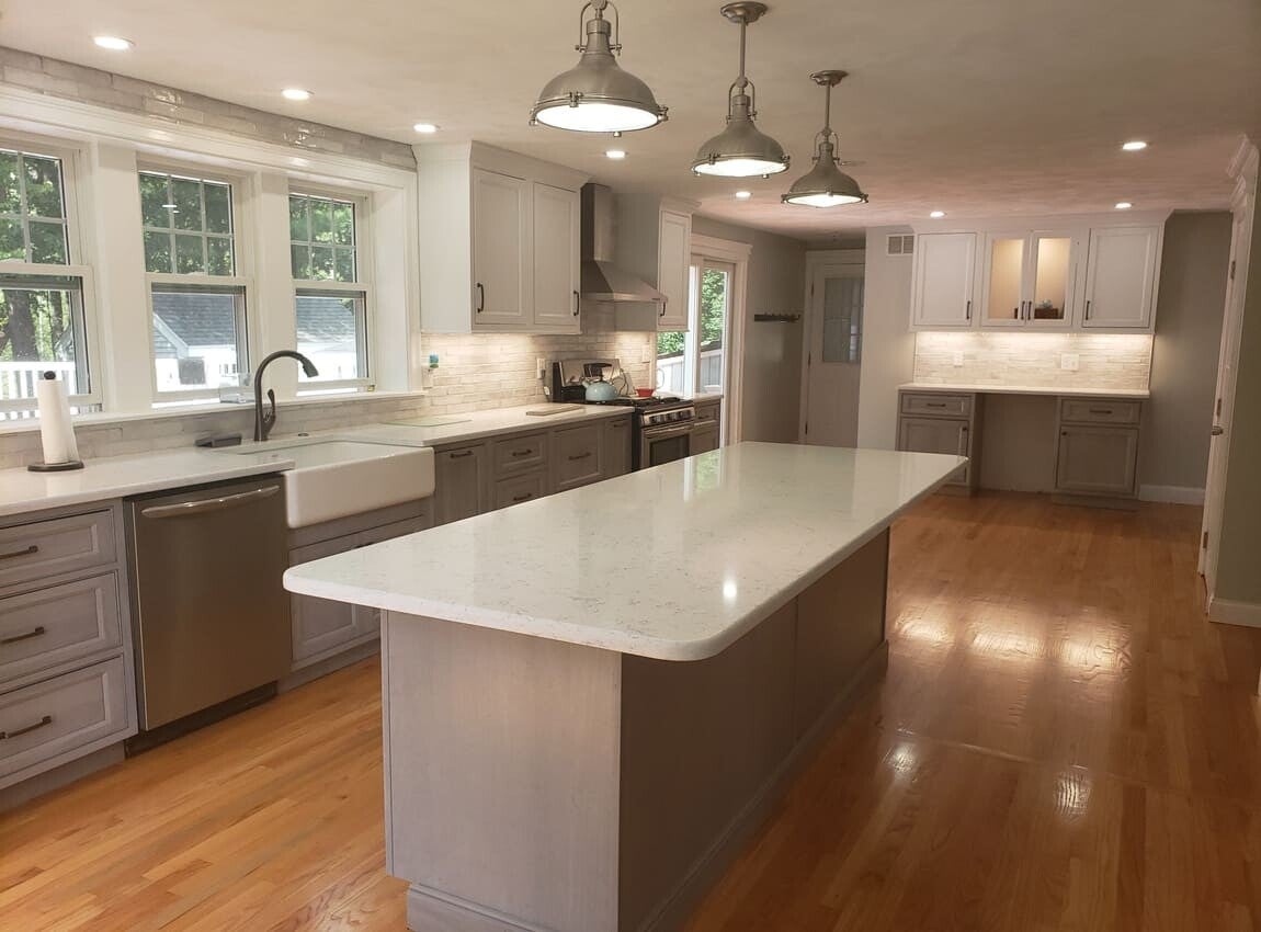 Renovated kitchen with modern cabinets, updated finishes, and a central island.