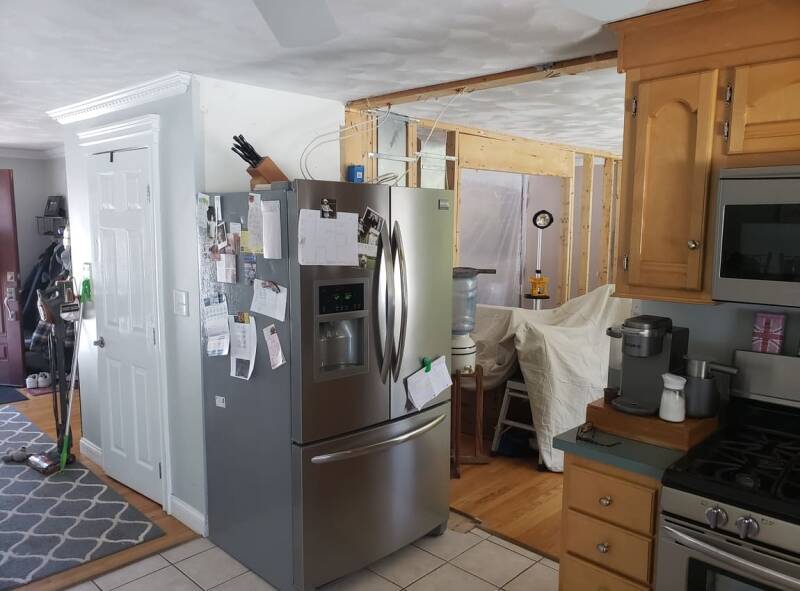 Kitchen remodel during installation with unfinished surfaces and tools present.