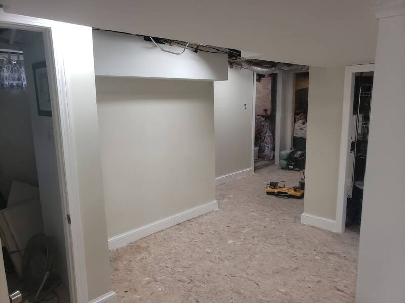 Basement under construction showing insulation and wall framing.