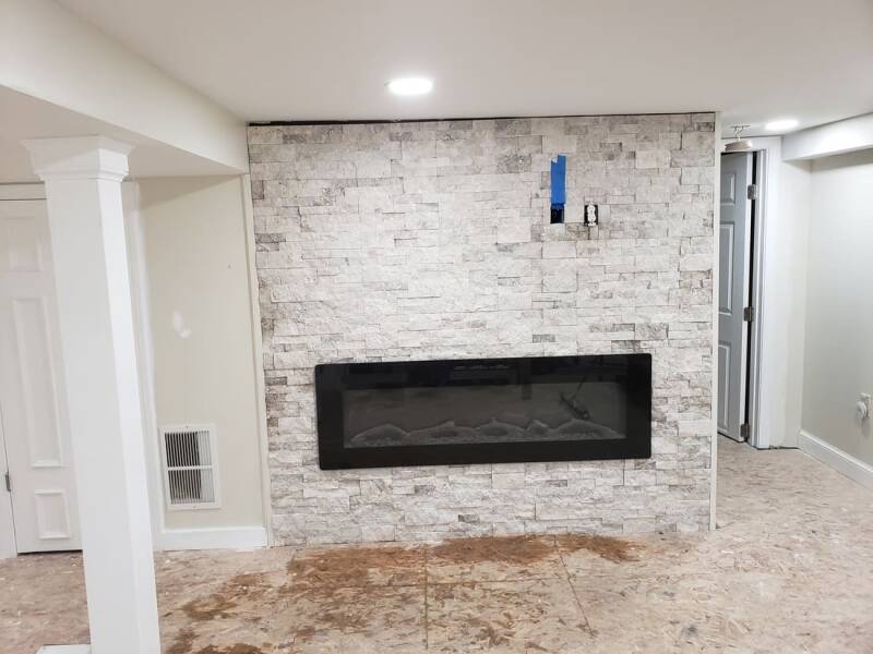 Basement renovation in progress with framing and exposed structural elements.