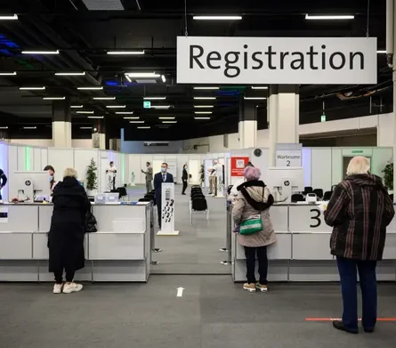 People waiting in line in a registration office in Switzerland.