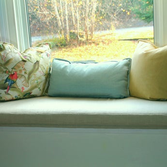 Bay windoe cushion in bedroom.
