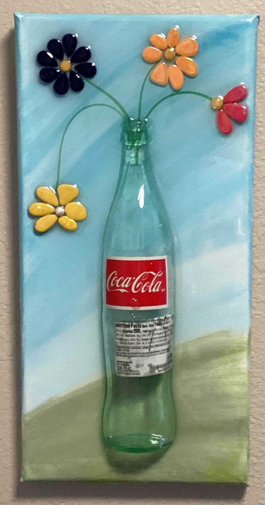 Coke bottle of flowers