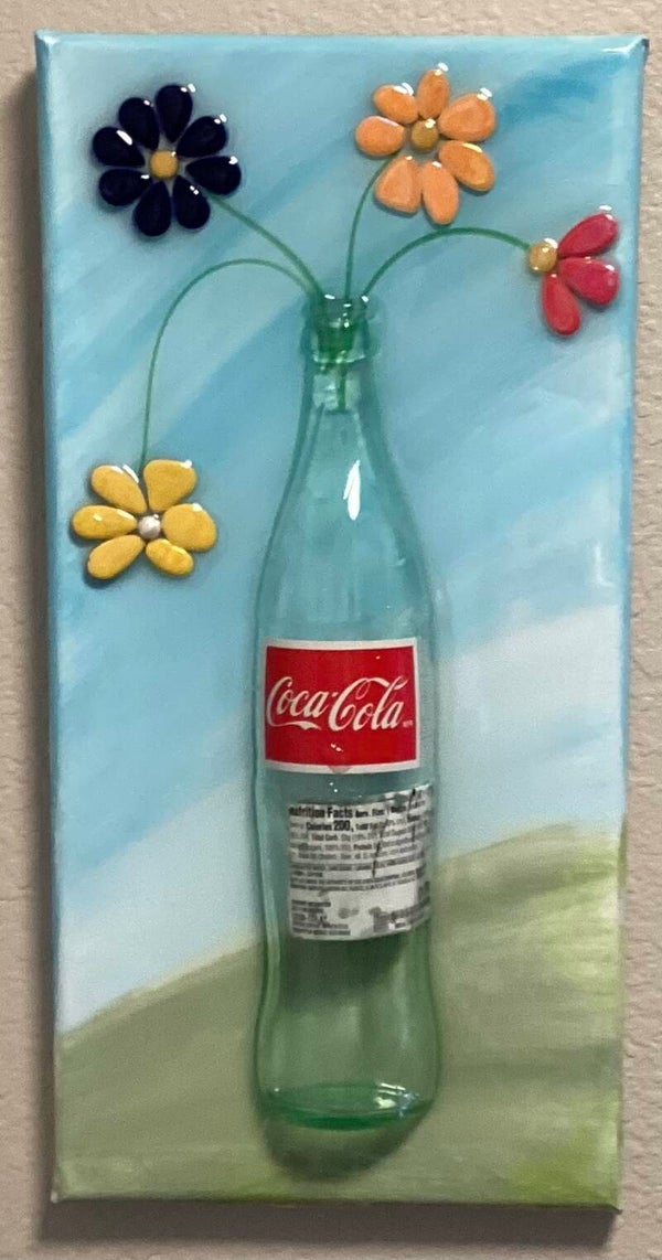 Coke bottle of flowers