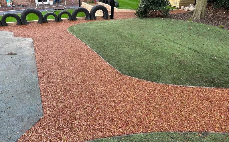 Green rubber playground surfacing in Kent