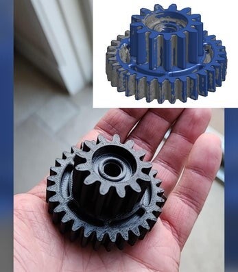 Hand holding a black 3D printed gear next to its blue finished version, demonstrating design and reverse engineering services. Precision 3D printing and custom part reproduction by 3D Creations in Slate Belt.