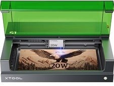 xTool 20W desktop laser engraver engraving a detailed eagle design on a wooden plaque. Professional laser engraving machine used by 3D Creations for custom engraving and personalization services in Bangor PA.
