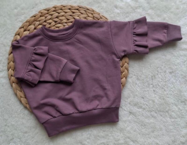 Oversized sweater paars/roze ruches mouw