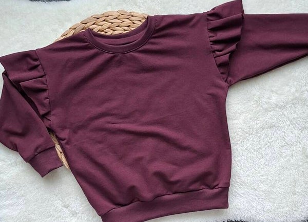 Sweater aubergine ruches schouders