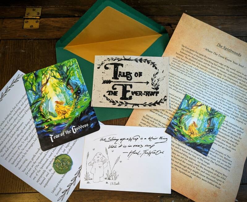A wooden table displaying contents from our mail club, Tales of The Ever-Awt. A Quill and ink, parchment, vintage paper, illustrations, other worldly, fantasy land, antique paper goods and illustrations 