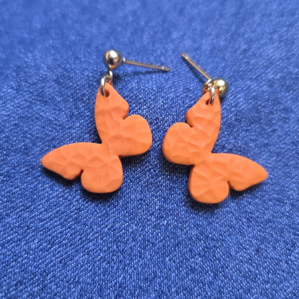 Oranje vlinder oorbellen