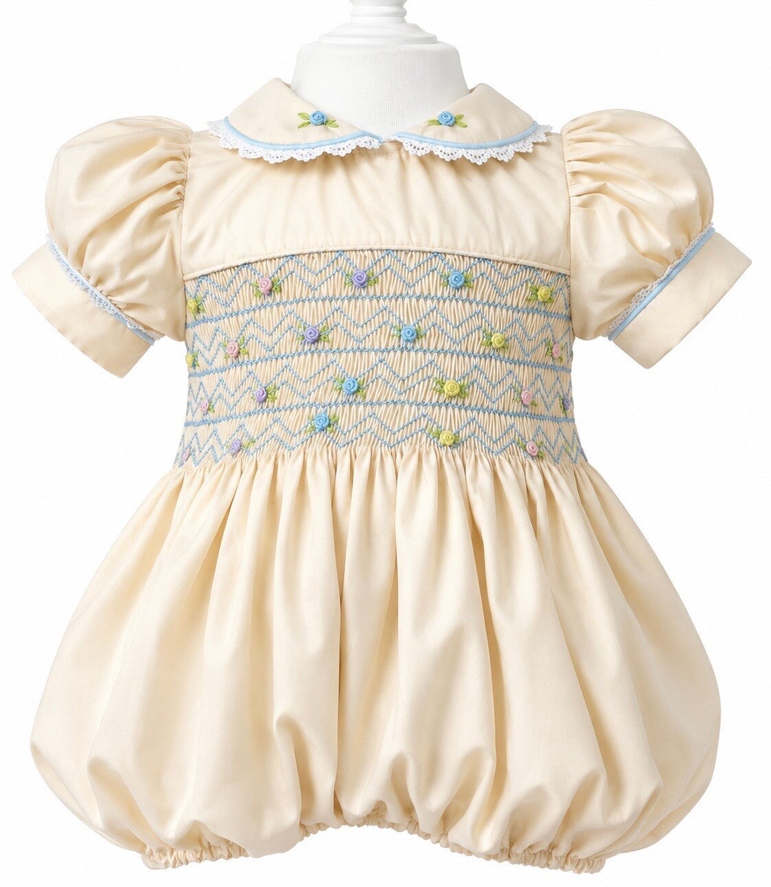Butter Cream Bubble Romper with Pastel smocking .
