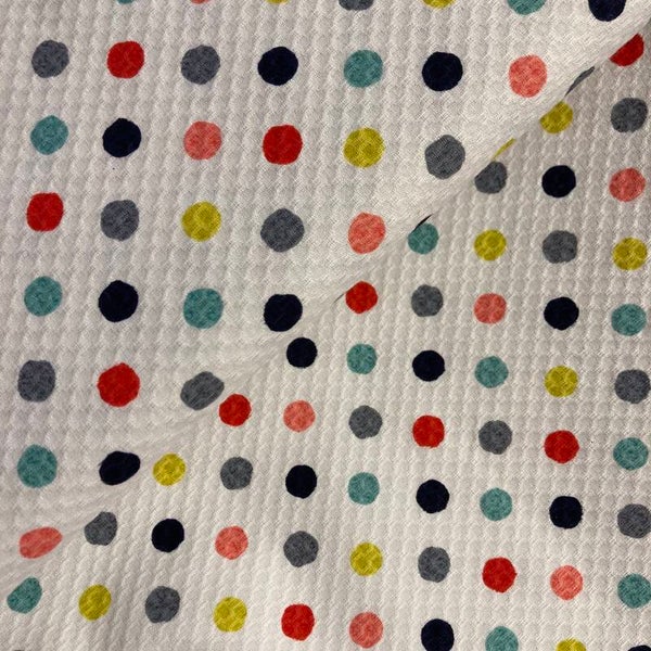 Pique stof met stippen 3017