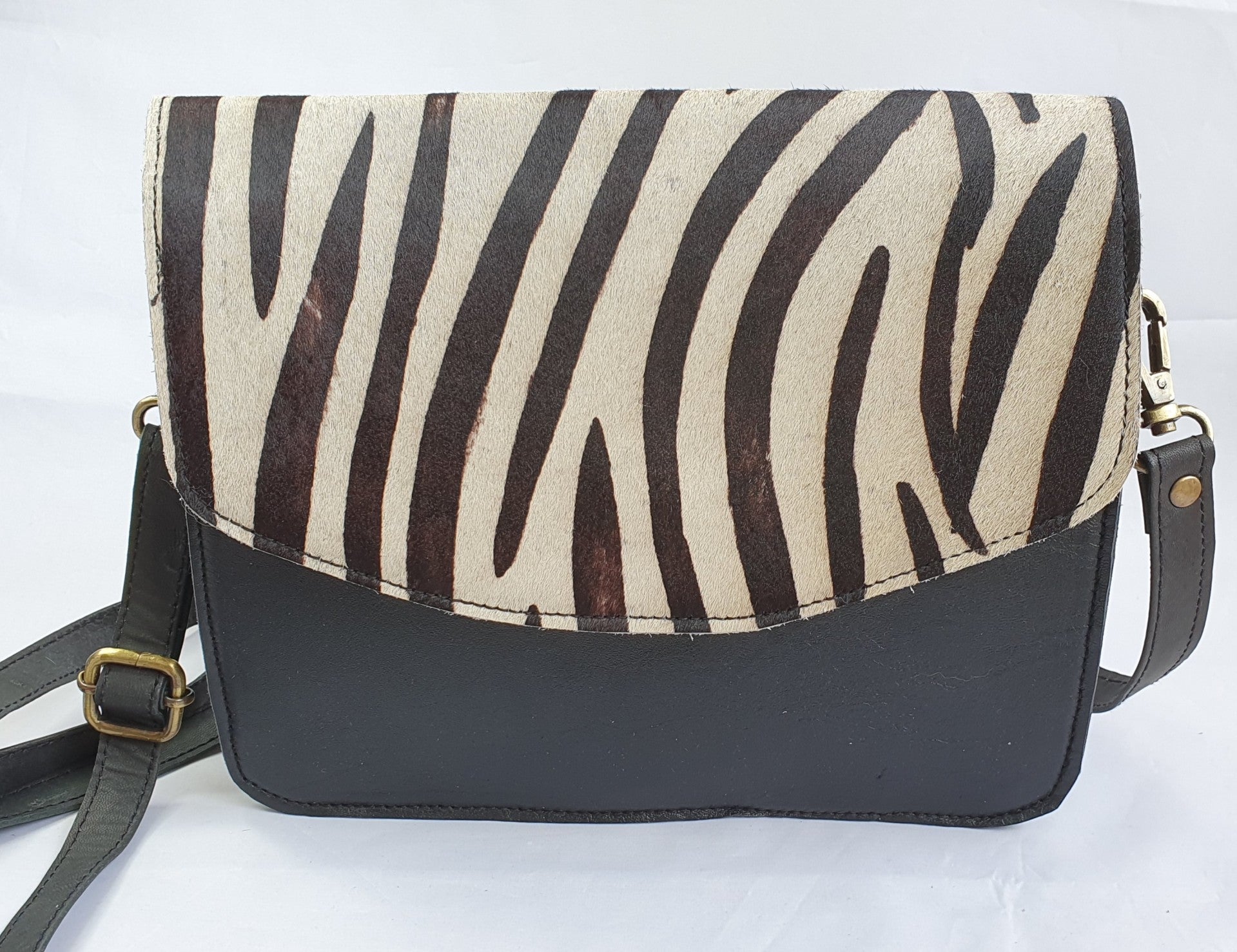 Mooie, leren schoudertas met zebraprint